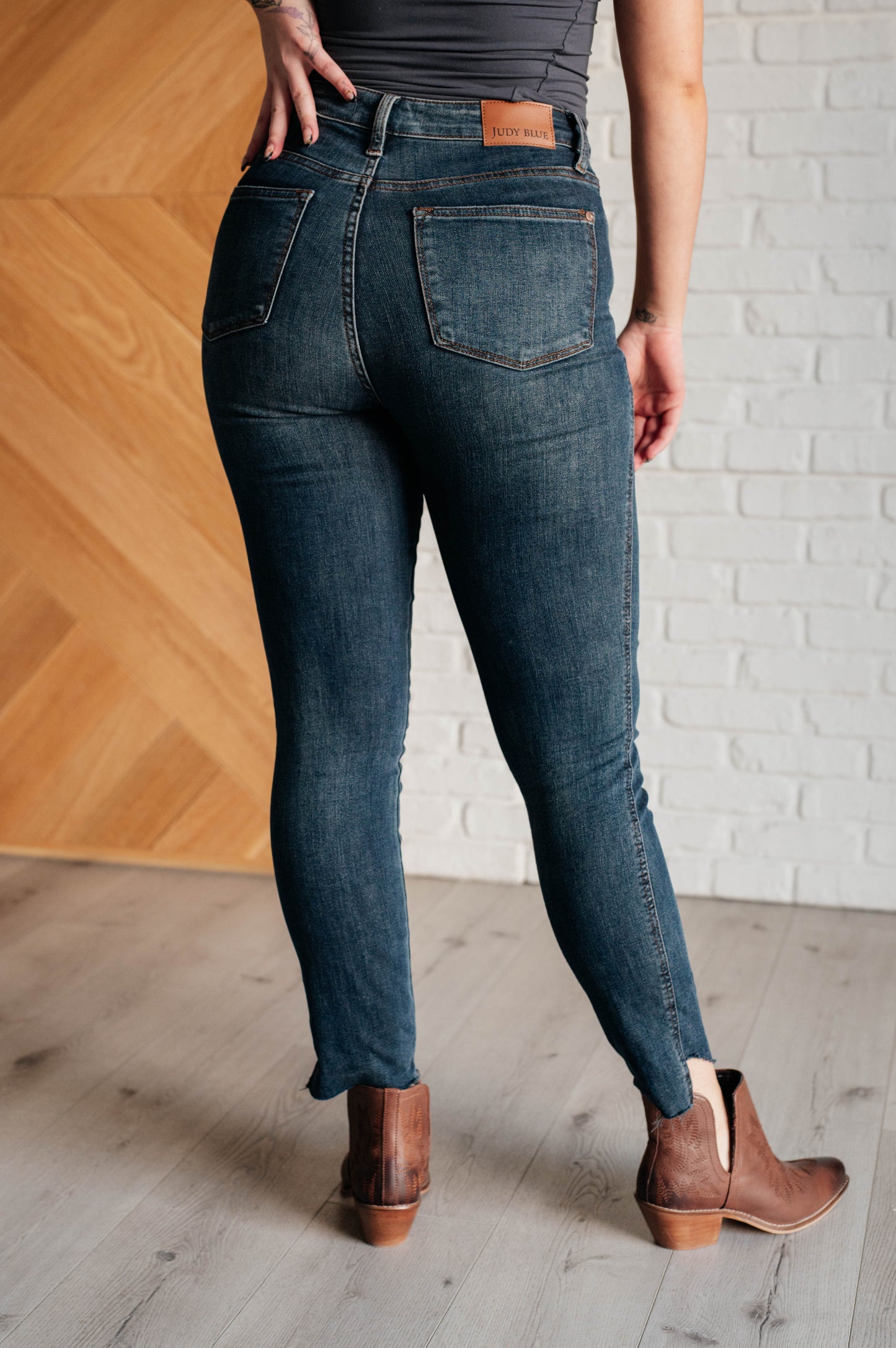 High Rise Control Top Step Hem Skinny Jeans